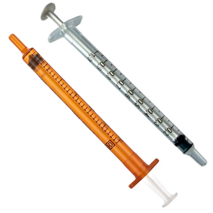 Two Becton Dickinson Oral Syringes are depicted diagonally on a white background, one with a transparent barrel and black markings, the other with an orange barrel. Both feature clear plungers and tips, ideal for precise liquid medicine dosages.