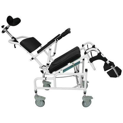 The image shows the Reclining Shower Commode Transport Chair by Vive Health, featuring a black cushioned seat, backrest, and leg rests. The chair has a white framework and green casters, tilted backward. It includes armrests and head support, making it an ideal transport chair for versatile mobility needs.