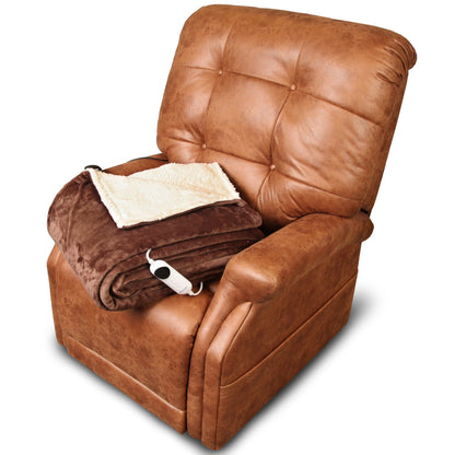 The Perfect Sleep Chair by Journey Health & Life Style is a plush, brown leather recliner equipped with dual motors for personalized reclining. It features a button-tufted backrest and includes a folded brown and beige sherpa-lined throw blanket on the seat, providing an ideal blend of comfort and relaxation.