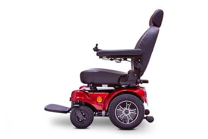 The EW-M51 Power Chair by E-Wheels is seen from the side in red with black cushioned seating. It includes a headrest, armrests, footrest, large wheels for mobility, and rear-wheel drive for superior maneuverability.