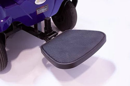 A close-up of a blue EW-M51 Power Chair by E-Wheels, featuring a black textured footrest extended against a white backdrop, highlights its rear-wheel-drive and wheel suspension system for ultimate stability.