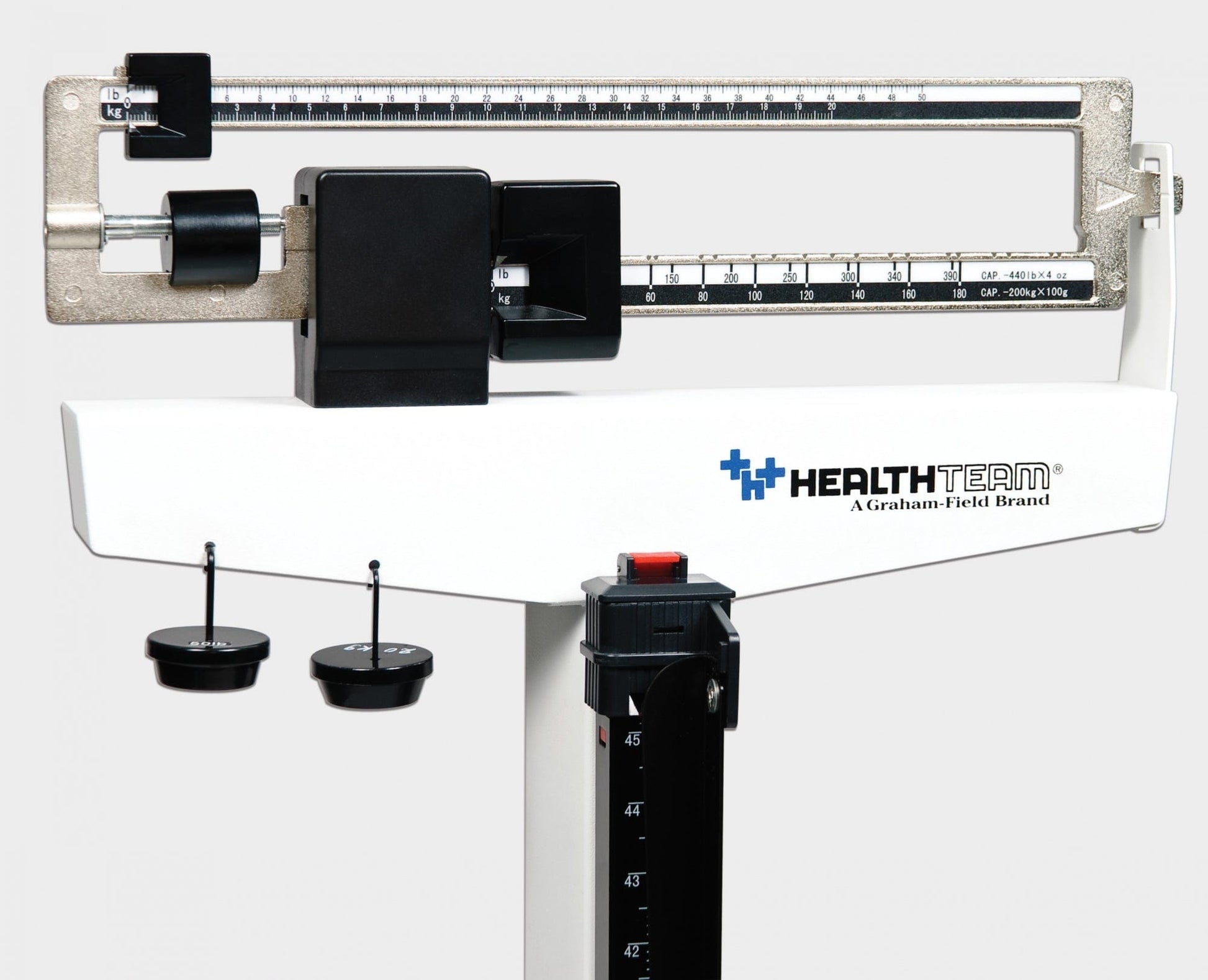 A white Physician Mechanical Beam Scale with Wheels, showcasing the "Graham Field" logo. This dual measurement scale has a weight capacity of 490 lb and features a calibrated beam for accurate weight tracking, along with two sliding indicators.