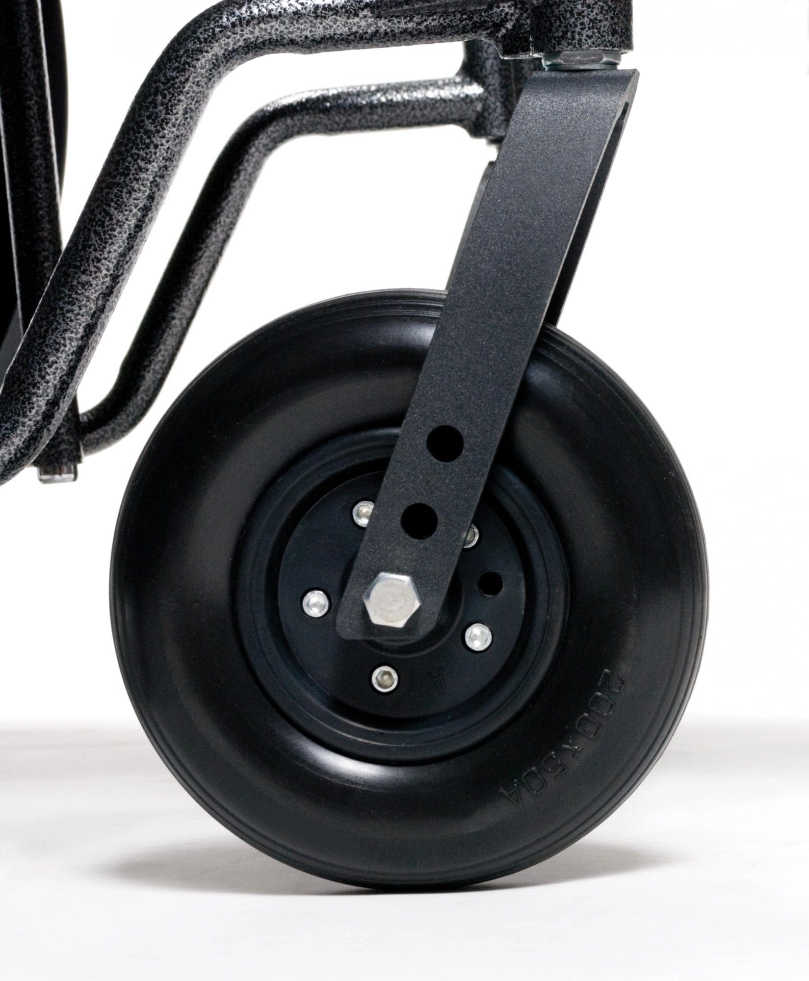 Close-up of the Graham Field Traveler HD wheel attached to a reinforced frame, ideal for hand trucks or trolleys. The wheel features a sleek, solid design with a hexagonal bolt in the center. The plain white background accentuates its robust quality.