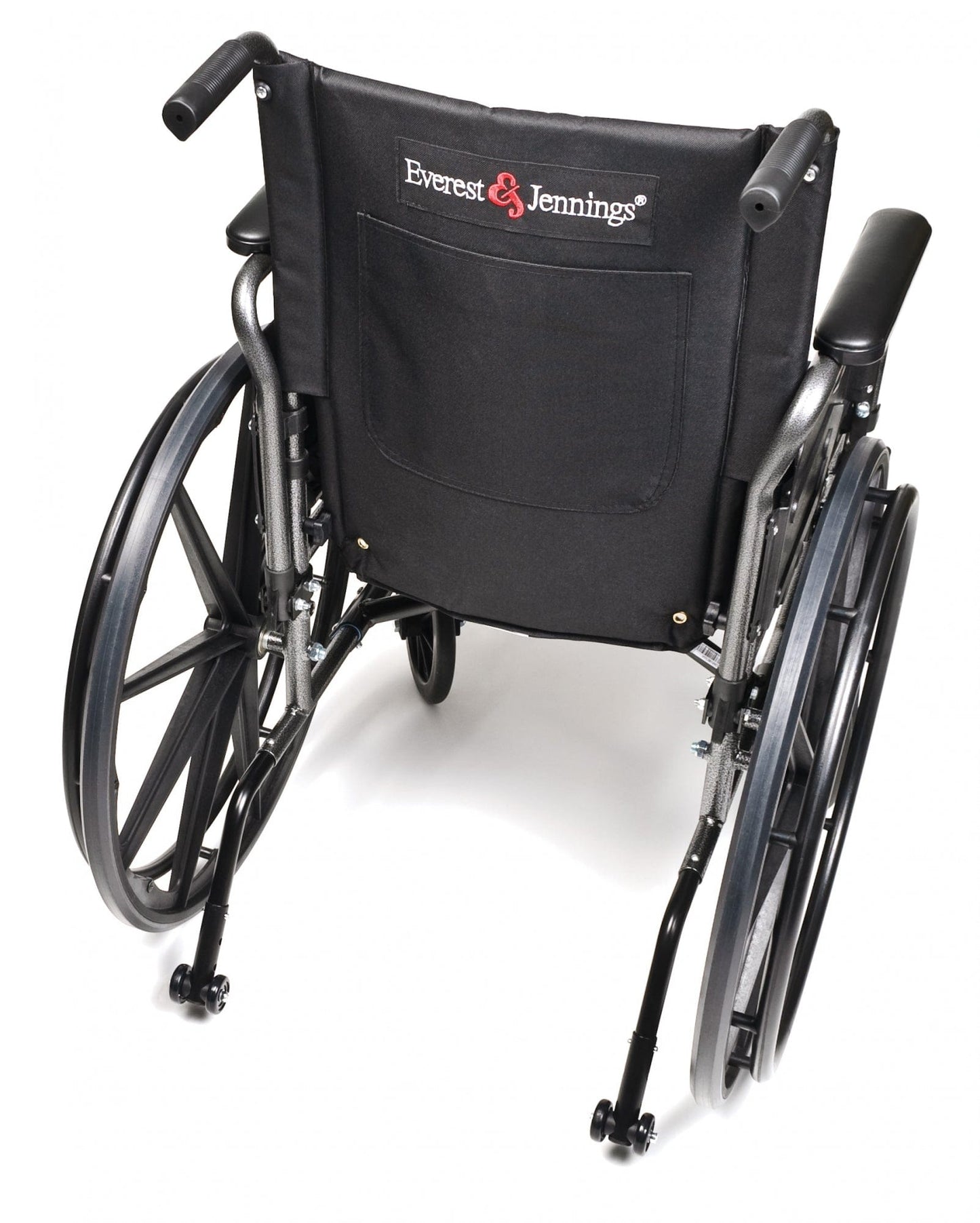 A lightweight black Graham Field Traveler L4 wheelchair is viewed from the back. It features two large rear wheels, two smaller front wheels, footrests, a fabric backrest with a pocket displaying the brand logo, and an adjustable seat height for added comfort.