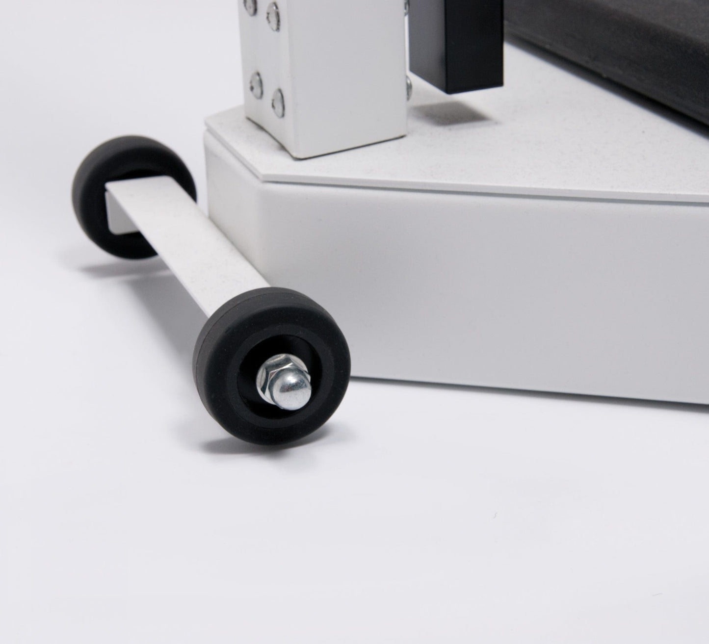 Close-up of the Graham Field Physician Mechanical Beam Scale with Wheels showcasing a white industrial or gym equipment base, complete with a black rubber wheel connected to a metal arm. The sleek design suggests mobility for the device, emphasizing its functionality and construction details in the minimal setting.