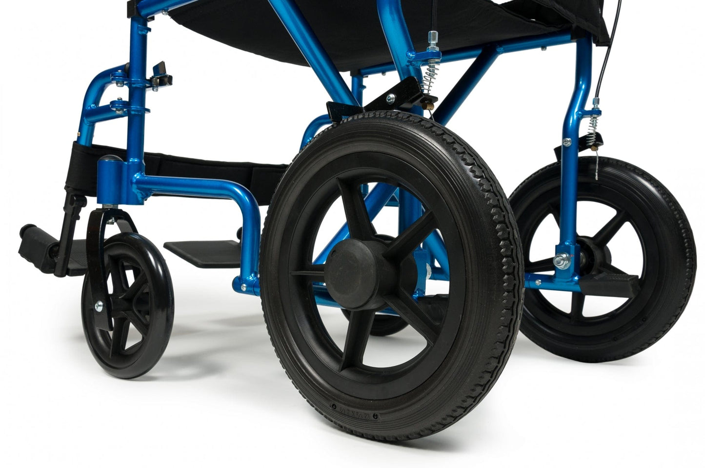 Close-up of the Graham Field Deluxe Aluminum 12" rear wheel Transport Chair, showcasing its blue aluminum frame and large black wheels. The image emphasizes its sturdy construction and smaller front wheels, while highlighting features such as the attendant wheel locks, focusing on the design of this versatile transport chair.