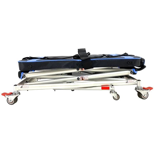 Introducing the So Lite Portable Lift by Journey Health & Lifestyle: a collapsible wheeled stretcher with a blue and black cushion, complemented by a black strap on top. It features locking caster wheels and is constructed with red and grey metal components, making it ideal for medical or emergency use.