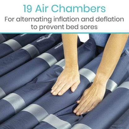 Hands touch a blue 8'' Alternating Pressure Mattress by Vive Health with 19 chambers, designed for bedsores prevention. It features an ultra-quiet compressor for peaceful rest.