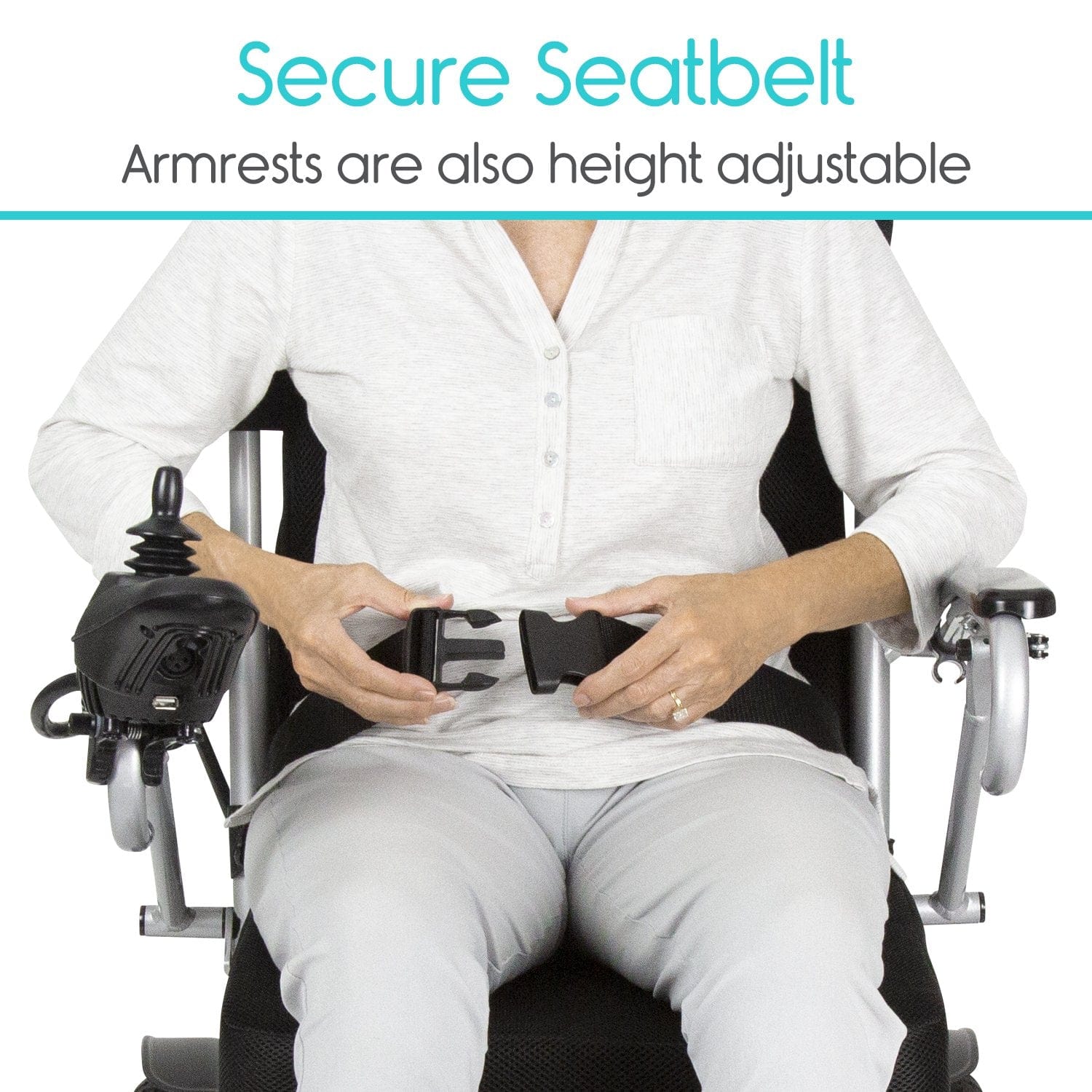 A person sitting in the Vive Health Power Wheelchair fastens a secure seatbelt, with a joystick controller conveniently located on the armrest. The text above reads "Secure Seatbelt," and notes that the armrests are also height adjustable.