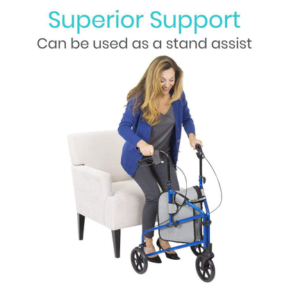 A woman uses the blue Tri-Rollator by Vive Health to stand up from a light beige chair. Text above her reads, “Superior Support: Can be used as a stand assist.”.