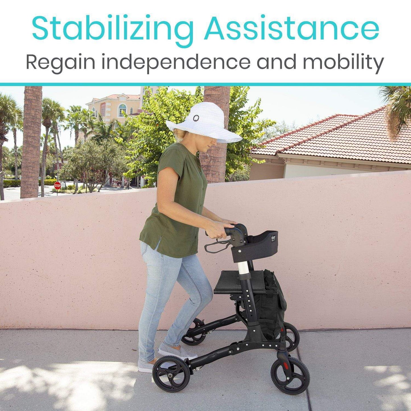 A person uses a Vive Health Rollator Walker with a seat for stable mobility on a sidewalk near a peach wall. Wearing a white sun hat, green shirt, and jeans, they embody "Stabilizing Assistance" and the message "Regain independence and mobility" against trees and buildings in the backdrop.