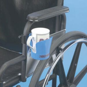 A Maddak Inc Cup Holder For Wheelchair, designed to attach to the armrest and perfect for holding a white mug, is showcased against a blue background. This essential wheelchair accessory highlights both functionality and sleek design.