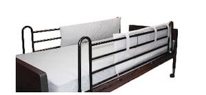 The Compass Health Bumper Pads For Bed Rails feature dark metal side rails and a simple wooden frame, providing a white mattress and bed rail pads for added comfort and safety.